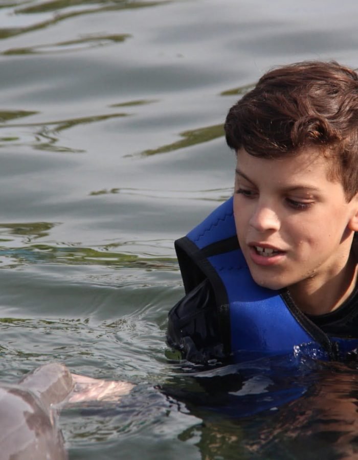 Sebastian’s 1st. encounter swimming with dolphins. He enjoyed it so much!